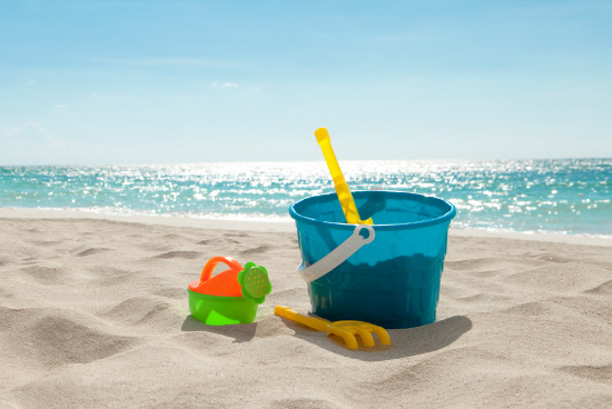 Toy bucket and shovel on a beach